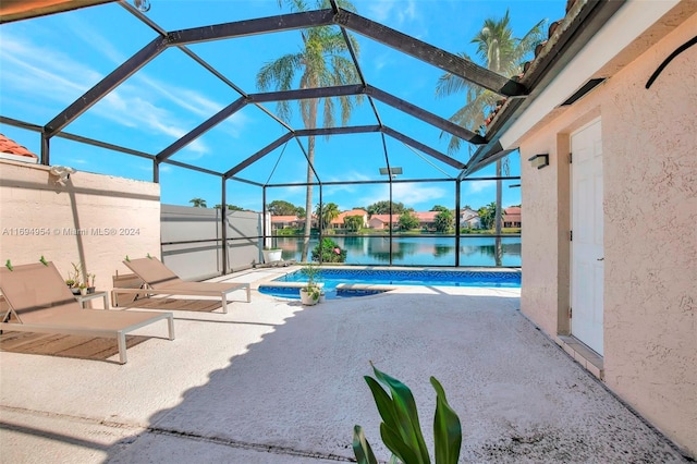 view of pool featuring a lanai, a patio area, and a water view