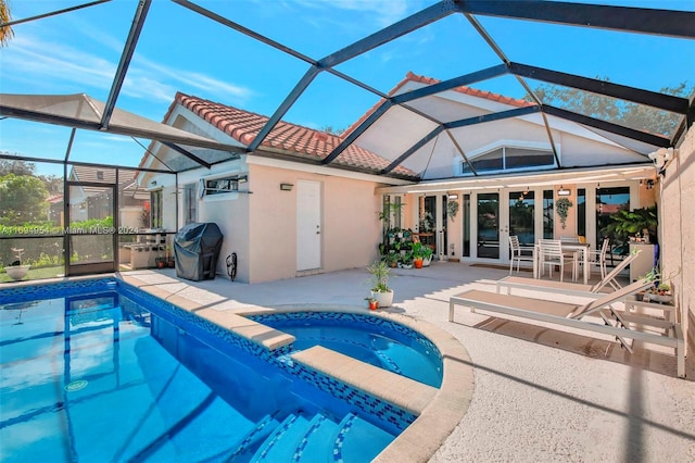 view of pool featuring a patio area, french doors, a lanai, area for grilling, and an in ground hot tub