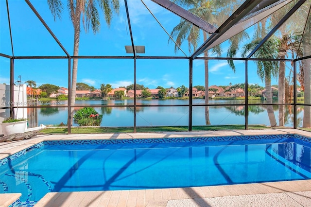 view of pool featuring a lanai and a water view