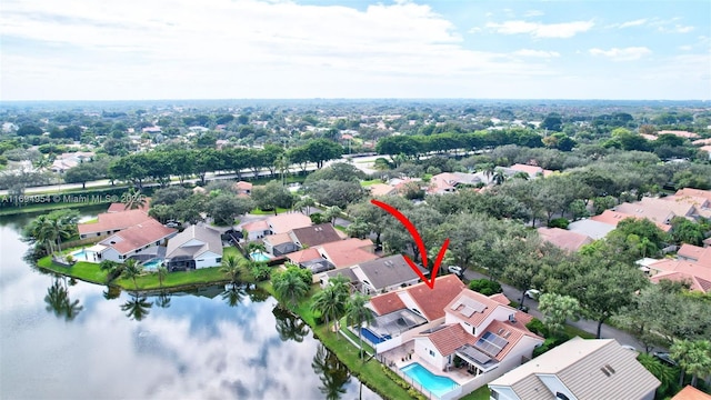 birds eye view of property featuring a water view