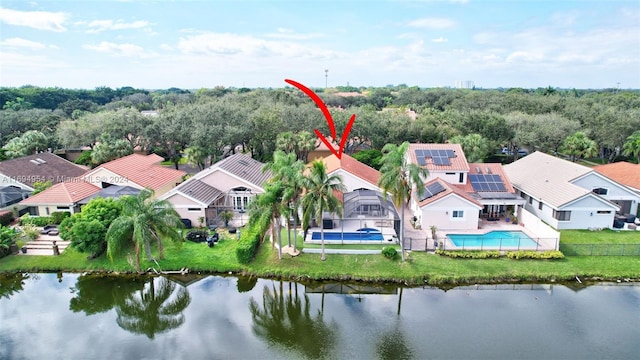 birds eye view of property with a water view