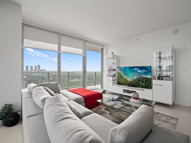 living room with expansive windows and light hardwood / wood-style floors