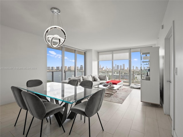 dining room with an inviting chandelier and floor to ceiling windows