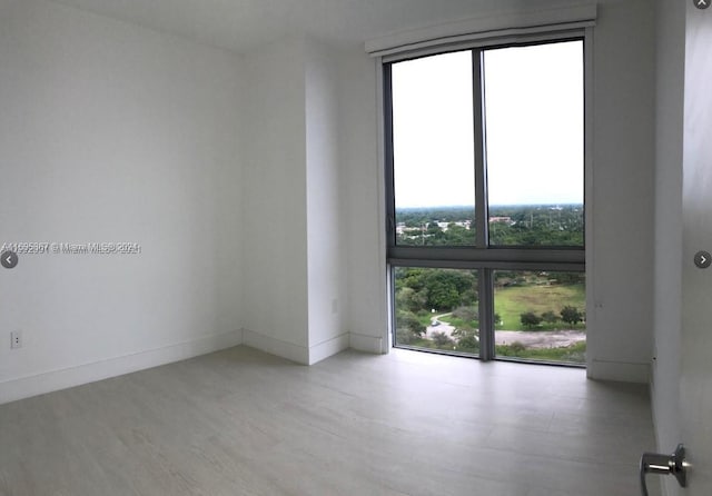 16385 Biscayne Blvd Unit 1615, North Miami Beach, FL 33160 - empty room with wood finished floors and baseboards