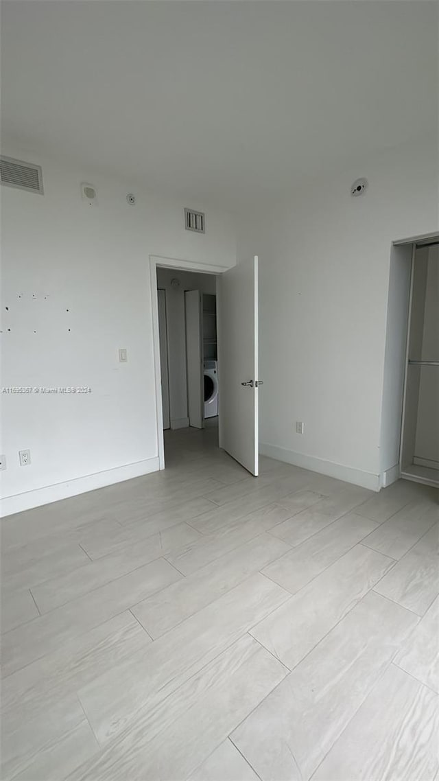 empty room with washer / dryer