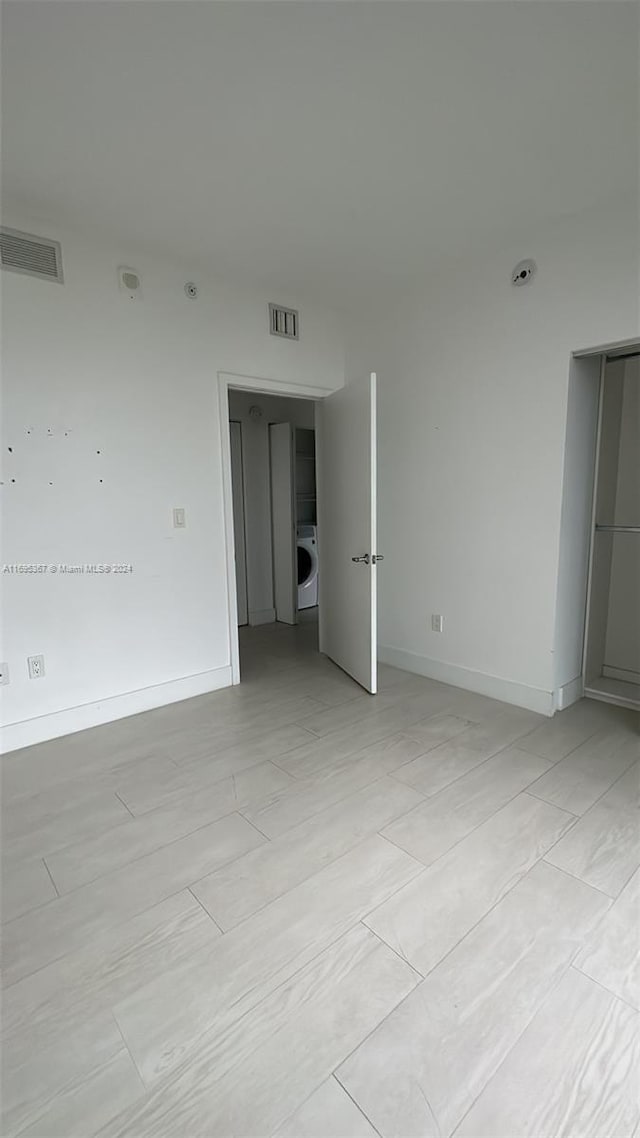 16385 Biscayne Blvd Unit 1615, North Miami Beach, FL 33160 - empty room with washer / clothes dryer and baseboards