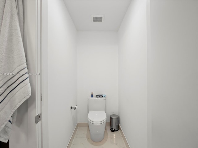 16385 Biscayne Blvd Unit 1615, North Miami Beach, FL 33160 - bathroom with toilet and marble look tiles