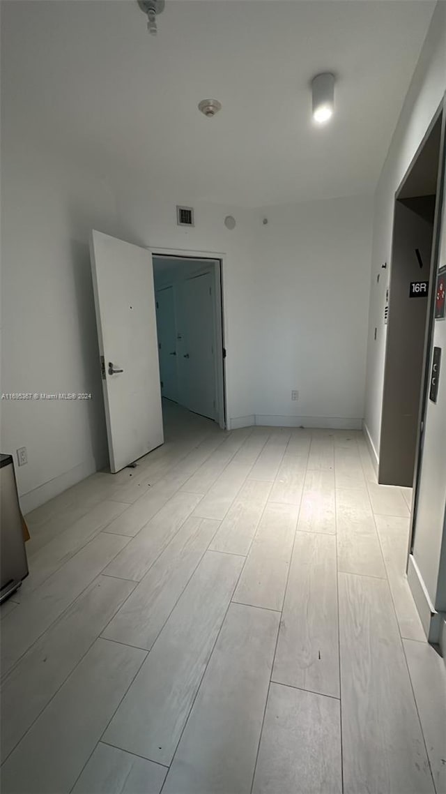 empty room featuring light wood-type flooring