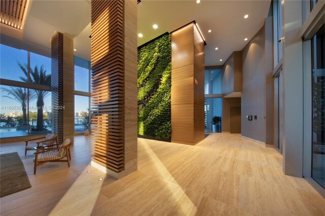 16385 Biscayne Blvd Unit 1615, North Miami Beach, FL 33160 - lobby featuring a towering ceiling, expansive windows, and recessed lighting