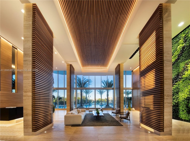 16385 Biscayne Blvd Unit 1615, North Miami Beach, FL 33160 - common area featuring expansive windows, a towering ceiling, and recessed lighting