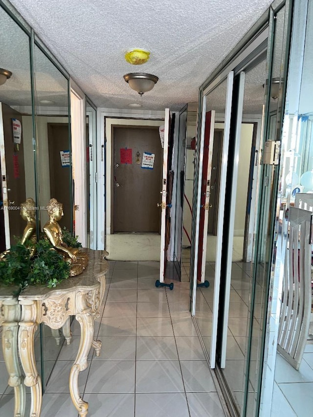 2025 NE 164th St Unit 215, North Miami Beach, FL 33162 - corridor featuring light tile patterned floors