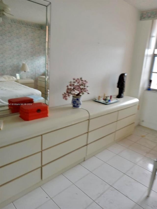 bathroom with tile patterned floors