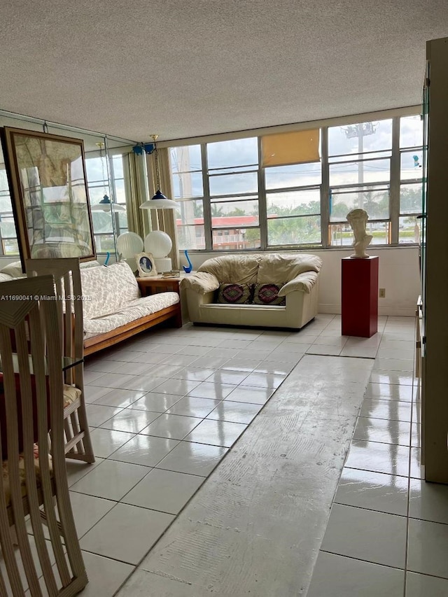 2025 NE 164th St Unit 215, North Miami Beach, FL 33162 - sunroom featuring healthy amount of natural light, tile patterned flooring, and a textured ceiling