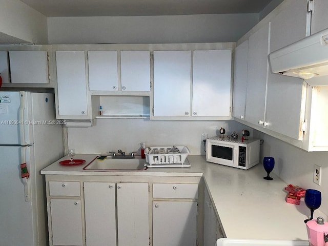 2025 NE 164th St Unit 215, North Miami Beach, FL 33162 - kitchen featuring white appliances, a sink, light countertops, white cabinetry, and open shelves