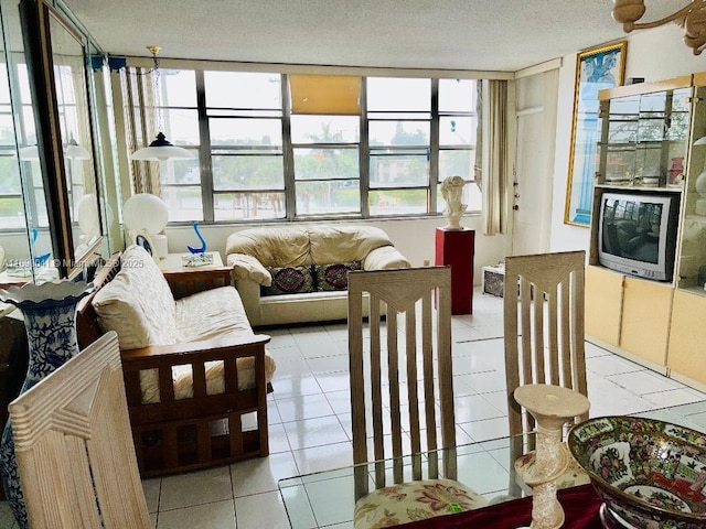 2025 NE 164th St Unit 215, North Miami Beach, FL 33162 - sunroom / solarium featuring tile patterned flooring and a textured ceiling
