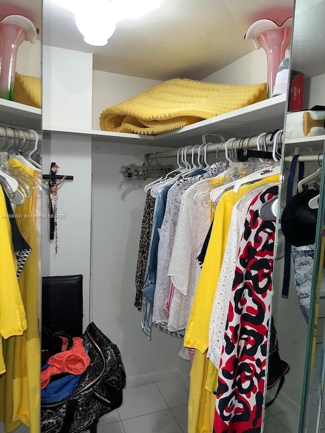 2025 NE 164th St Unit 215, North Miami Beach, FL 33162 - spacious closet featuring tile patterned floors