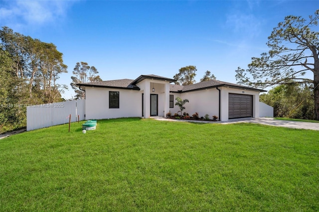 view of front facade featuring a garage and a front lawn