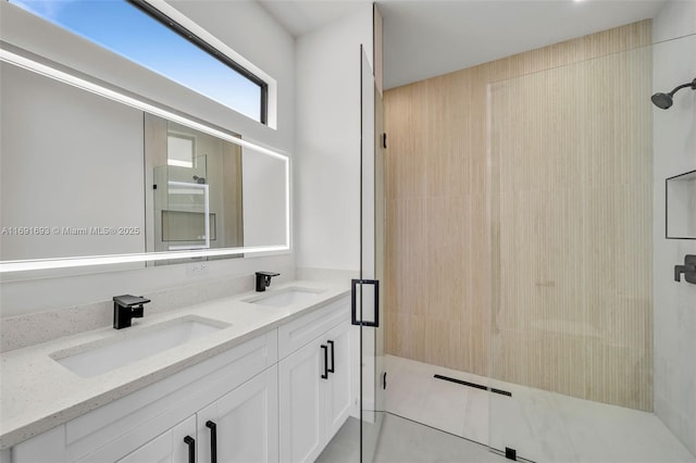 bathroom with vanity and a shower with shower door