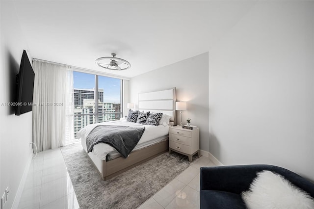 bedroom featuring access to outside and light tile patterned floors