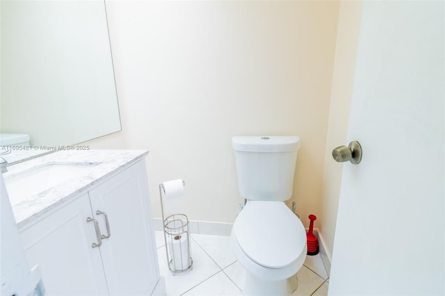 bathroom with tile patterned floors, toilet, and vanity