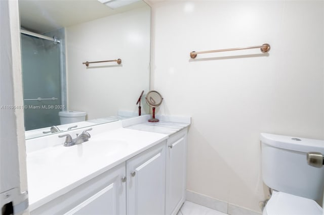 bathroom featuring vanity, walk in shower, tile patterned floors, and toilet