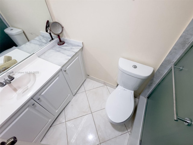 bathroom featuring vanity, an enclosed shower, tile patterned flooring, and toilet