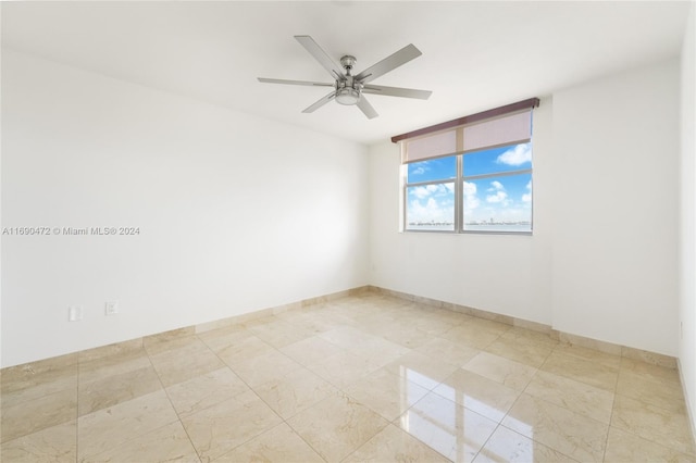 unfurnished room featuring ceiling fan