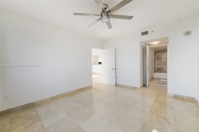 unfurnished room featuring ceiling fan