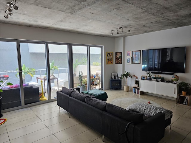 living room featuring track lighting and light tile patterned flooring