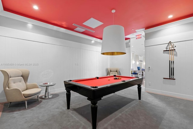 recreation room with carpet floors, wood walls, and pool table