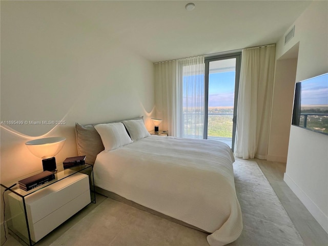 bedroom featuring a wall of windows