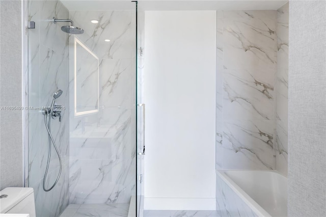 bathroom featuring toilet and tiled shower / bath combo