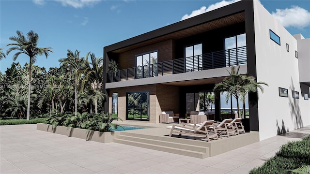 rear view of property featuring a patio area and a balcony