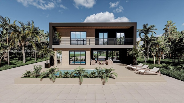 rear view of house featuring a patio area and a balcony