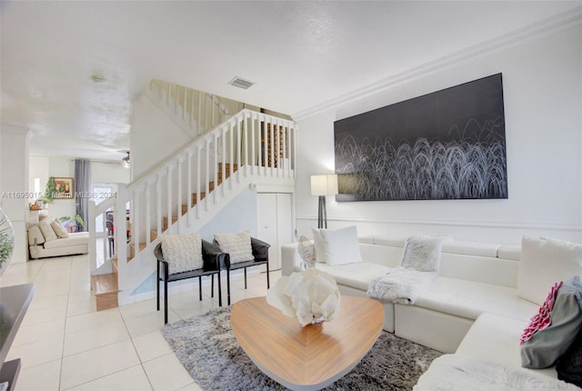 tiled living room with ornamental molding