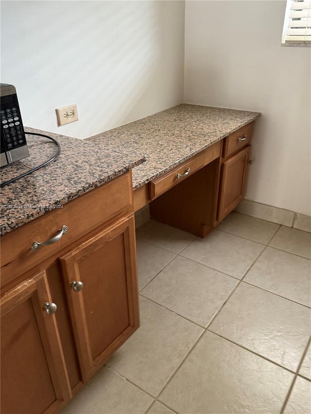 bathroom with tile patterned floors