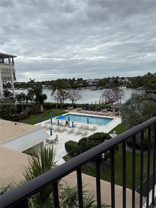 view of pool with a water view