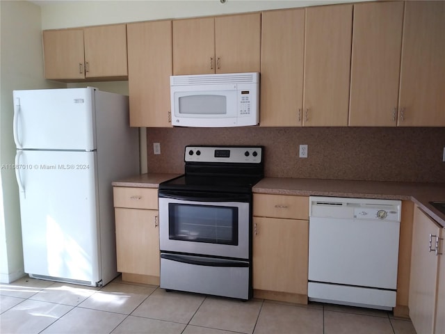 kitchen featuring tasteful backsplash, light brown cabinets, light tile patterned floors, and white appliances