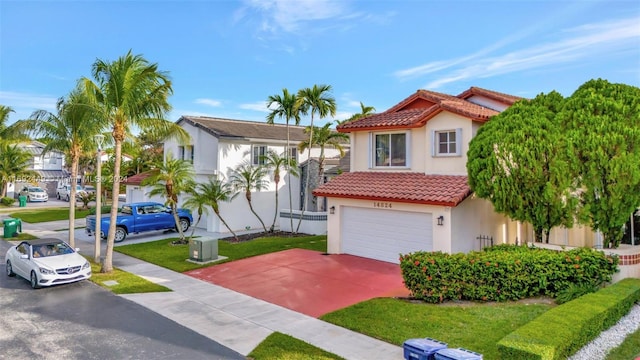 mediterranean / spanish-style home featuring a garage