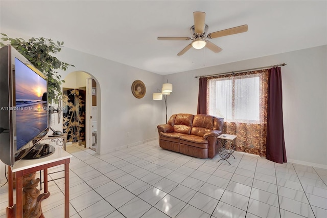 living room with ceiling fan and light tile patterned floors