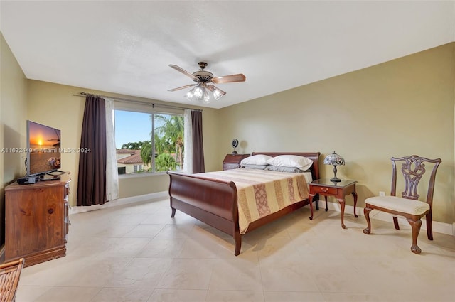 bedroom featuring ceiling fan and light tile patterned floors