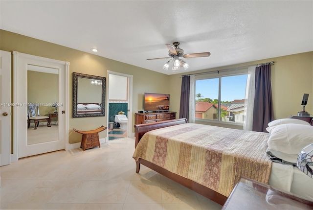 tiled bedroom featuring ceiling fan, a textured ceiling, and connected bathroom