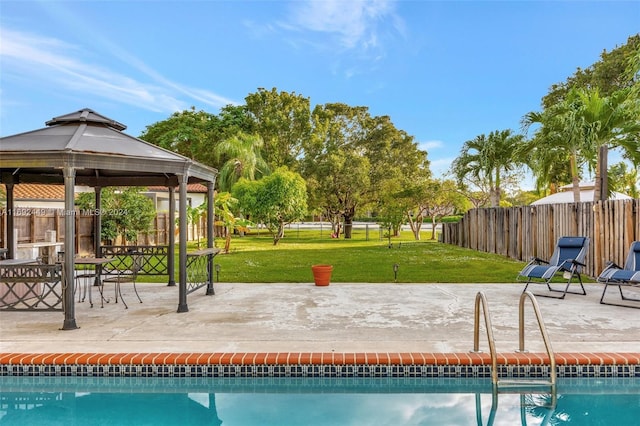 view of pool featuring a gazebo, a yard, and a patio