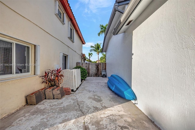 view of side of property featuring a patio area