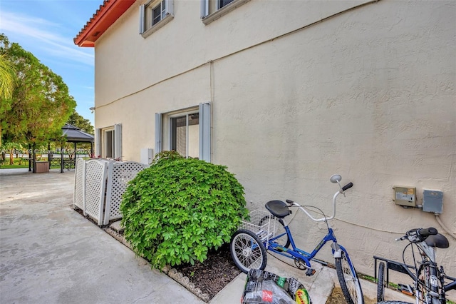 view of property exterior featuring a patio area