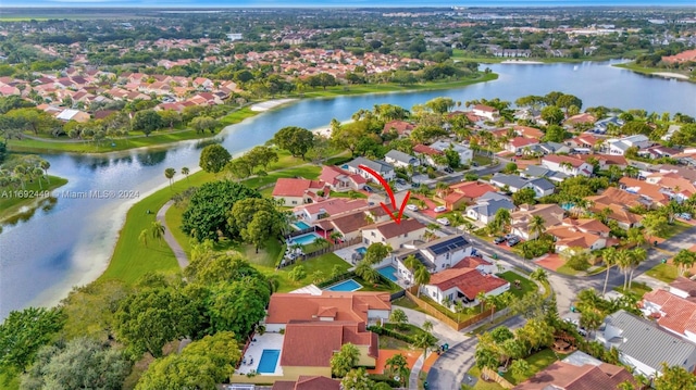 birds eye view of property featuring a water view