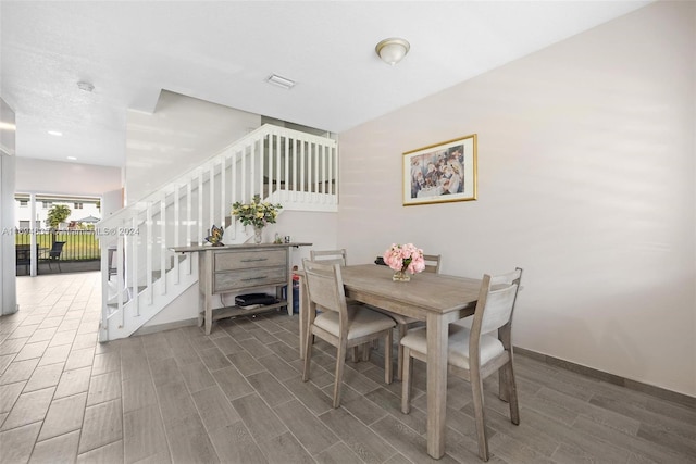 dining area with dark wood-type flooring