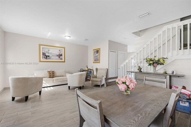 dining space featuring light wood-type flooring