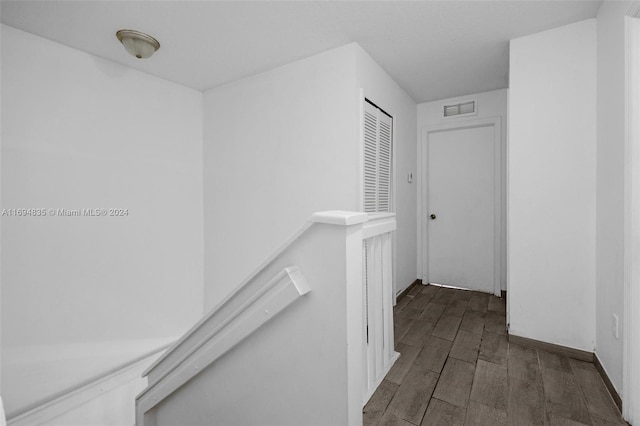 hall with dark hardwood / wood-style floors