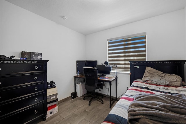 bedroom with light hardwood / wood-style flooring